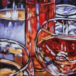 close-up of a table on the patio set with a rosé wine and water