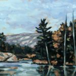 Lake, rocks, white pines and orange maples with la cloche mountains in the background