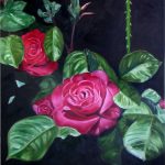 two red roses and green leaves on a dark, almost black background