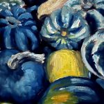 bluish green and zebra striped pepper squash, and a yellow squash on a table